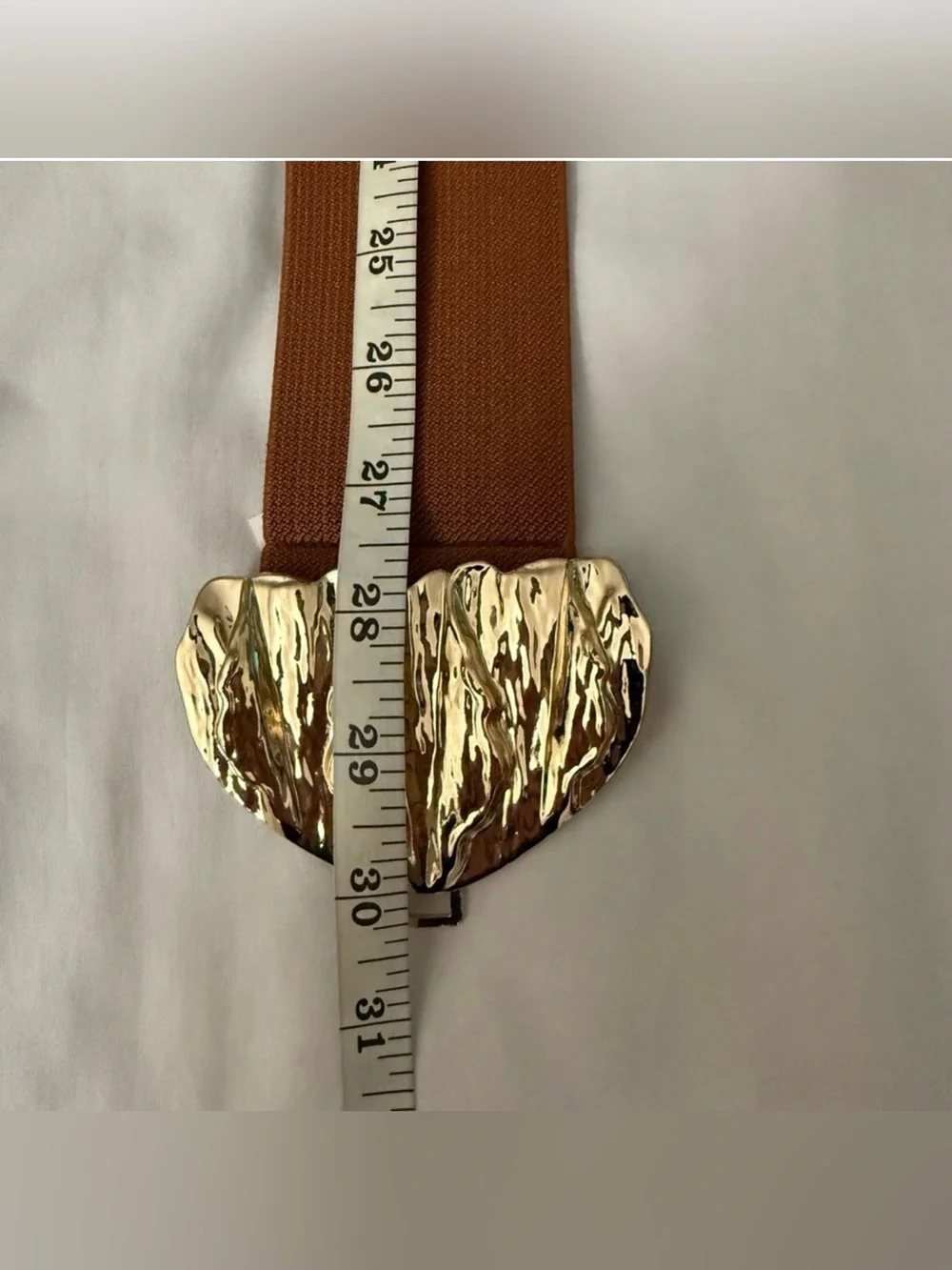 Brown elastic waistband belt with gold tone butterfly buckle